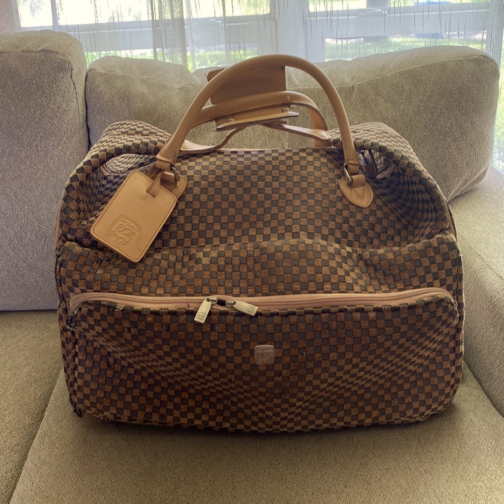 Classy carry on luggage. Has wheels and expands easily